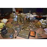 A good selection of brass wares including a pair of antique Lucerne oil lamps bugles perpetual