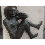 A cast sculpture attributed to Michael Jenkins, crouched nude, 53 x 48cm