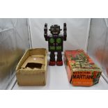 A 1960's Horikawa S H (Japan) battery operated tinplate 'Attacking Martian' Robot, in original