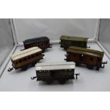 Five Bing and similar tin plate 0 gauge Four Wheel Coaches and Wagons