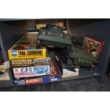A shelf of Military related Games and Toys including Tank Command, Waterloo Wargame, Colditz,
