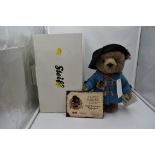 A Steiff Limited Edition 2008 Paddington Bear, wearing blue coat, black hat, medal and label, having