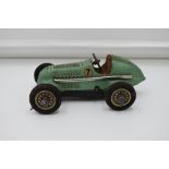 A Schuco Studio Tin Plate & Clockwork Mercedes Racing Car, model no 1050, in green having no 7
