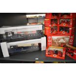 A shelf of modern diecasts including two Corgi 1:50 scale Fuel Tankers, Q8 & Esso along with