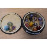 A collection of twenty one Victorian and later Glass Marbles of varying size, most having