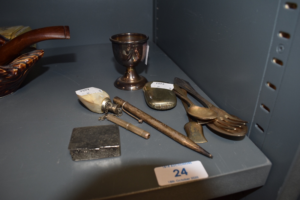 A selection of curios including mother of pearly scent bottle and Wyvern propelling pencil