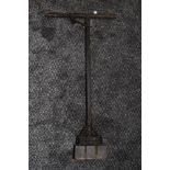 A vintage agricultural tool or similar.