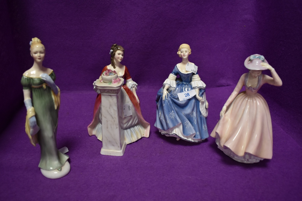 A selection of figurines of ladies in dress including Royal Doulton