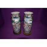 A pair of Chinese or similar vase having famille rose decoration