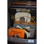 A selection of vinyl records and cossor radio set