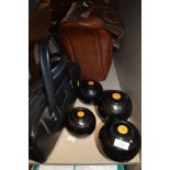 A selection of crown green bowls and bag including Thomas Taylor