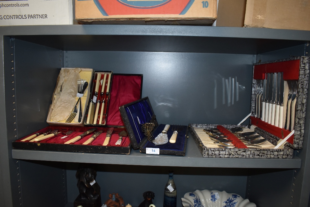 A selection of vintage canteens of cutlery including fish knifes and forks.