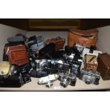 A selection of photography equipment and cameras including Praktica Halina and Paxette