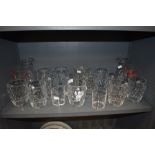A selection of glass wares including beer pint glasses and water jugs