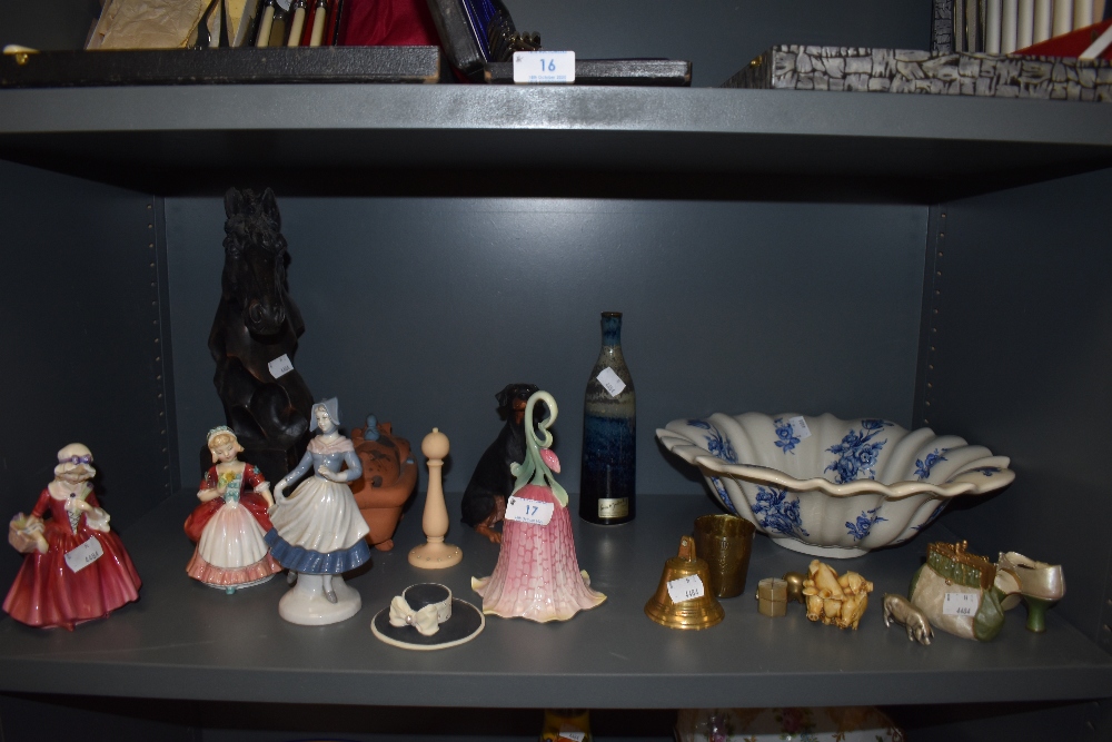 A selection of decorations including figures by Royal Doulton and Franz flower bell