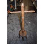 An antique wooden posser.