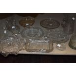 An assortment of predominantly vintage pressed glass and similar including cake stands, jugs, dishes