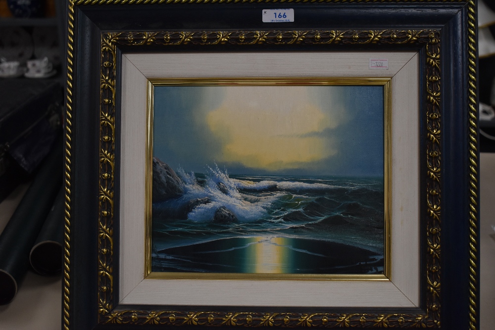 A modern oil on canvas depicting stormy sea scape in wood and gilt effect frame