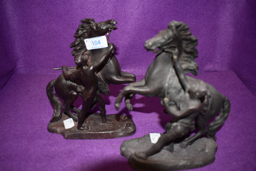 A pair of bronzed spelter figures, Horse and charioteer in Marley style after Coustou.