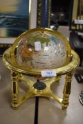 A modern Gemstone Globe having brass cradle and relevant documentation