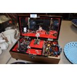 A musical jewellery box having ballerina to centre and mirrored back, containing a selection of