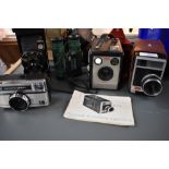 A selection of cameras including Coronet vest camera, Brownie Flash III, Kodak 8 movie camera,