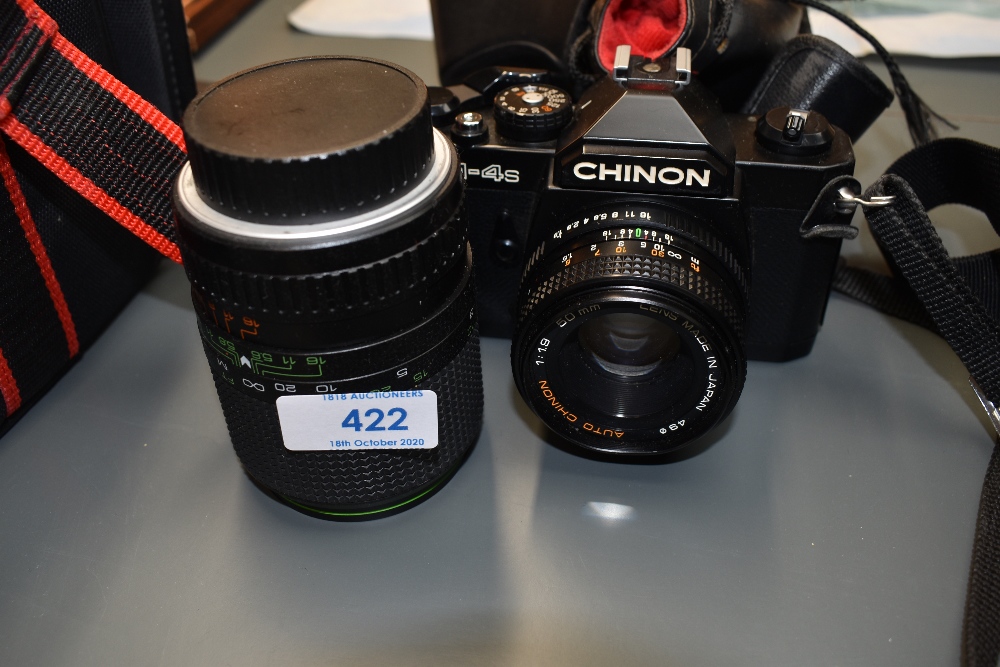 A Chinon Cm-4s 35mm camera with Chinon 50mm and Mirage Mk11 135mm lens