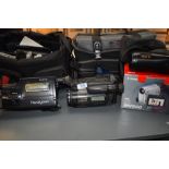 A selection of video cameras including Sony Handycam, Sony Handy Cam Hi8, Epoca 135, Canon MV890