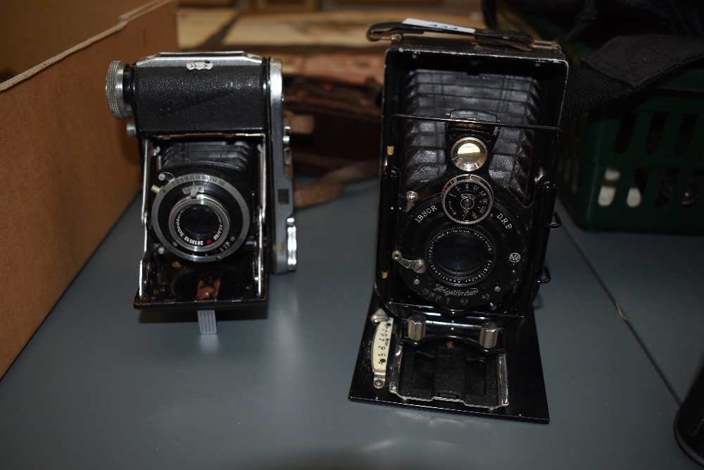 Two folding cameras, a Baldinette and a Vogtlander by Walter Talbot, Berlin