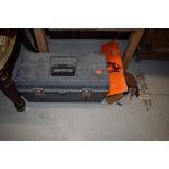 A toolbox and contents including Black and Decker power saw parts