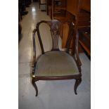 An Edwardian inlaid salon armchair