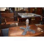 A small oak occasional pedestal table