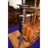 An antique wine table having mahogany frame with barley twist stem