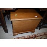 An early to mid 20th Century bleached mahogany bedding box/maybe ex gramophone cabinet, on ball