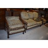 A late 19th/early 20th Century bergere back lounge suite , having mahogany, walnut and bergere