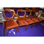 A set of five balloon back dining chairs with upholstered seats