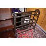 A Victorian dark stained towl rail with a Shaker design