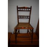 A Victorian stained frame bedroom chair having canework seat