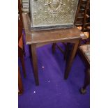 An oak games or tea table in dark stained oak