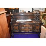 A vintage dark stained oak sideboard with rack