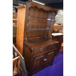 A traditional Priory style dark oak dresser, width approx. 94cm