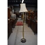 A traditional brass standard lamp on mahogany base, probably early 20th century, approx. height