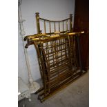 Three antique brass single beds, with decorative irons