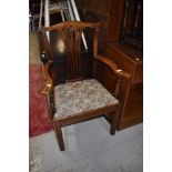 A 19th Century stained frame arm chair having splat back and upholstered seat
