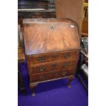 A small size flame mahogany veneer bureau approx 60cm wide by 100cm tall