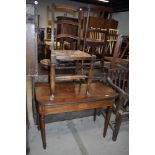 A Victorian mahogany fold over tea table having inlaid frieze, and a traditional rush seated country