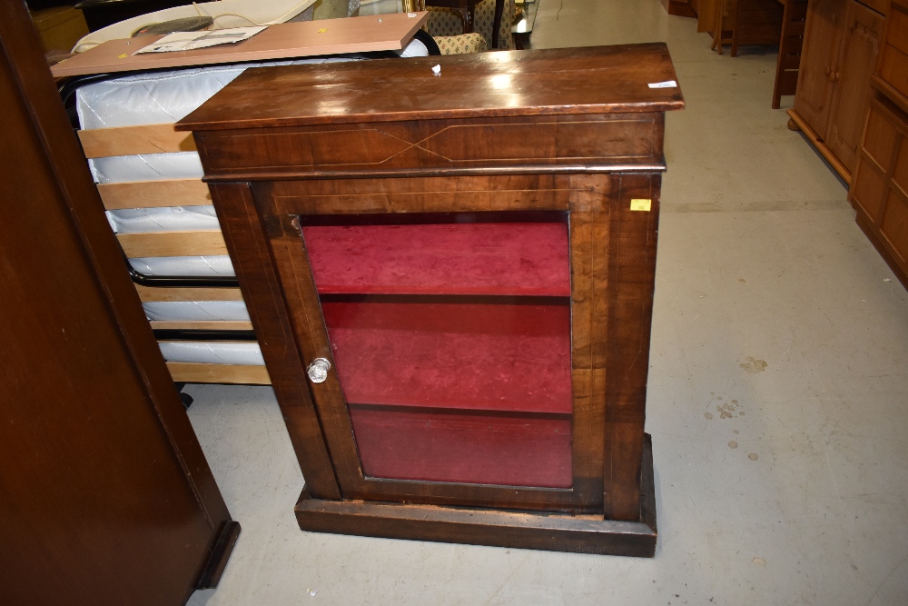 A 19th Century Empire style low display cabinet, having line inlay decoration, with plush lined