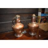 A pair of 19th Century copper lidded ewers