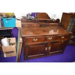 A period oak dresser base, having ledge back with four drawers, three frieze drawers and double