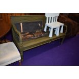 A two seater wooden garden bench